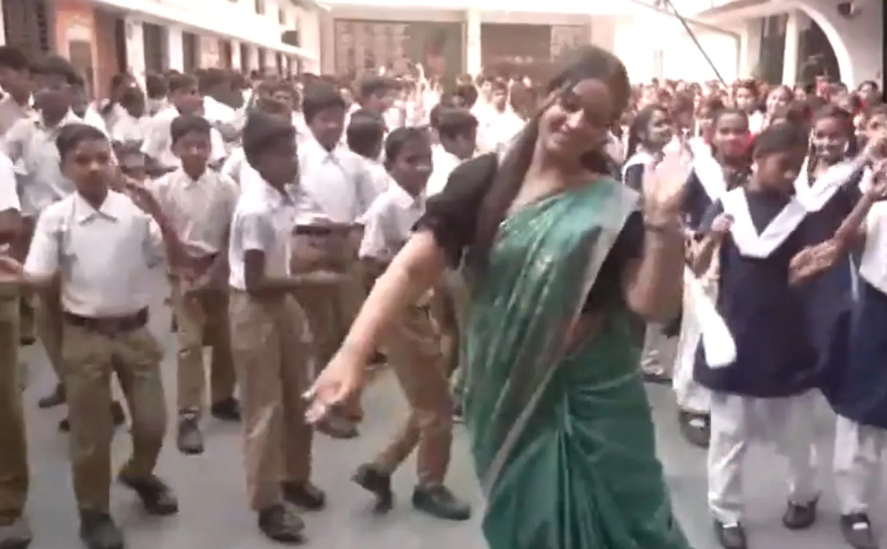  Teacher dances with students in school to a song on Lord Rama called Jaya Shriram