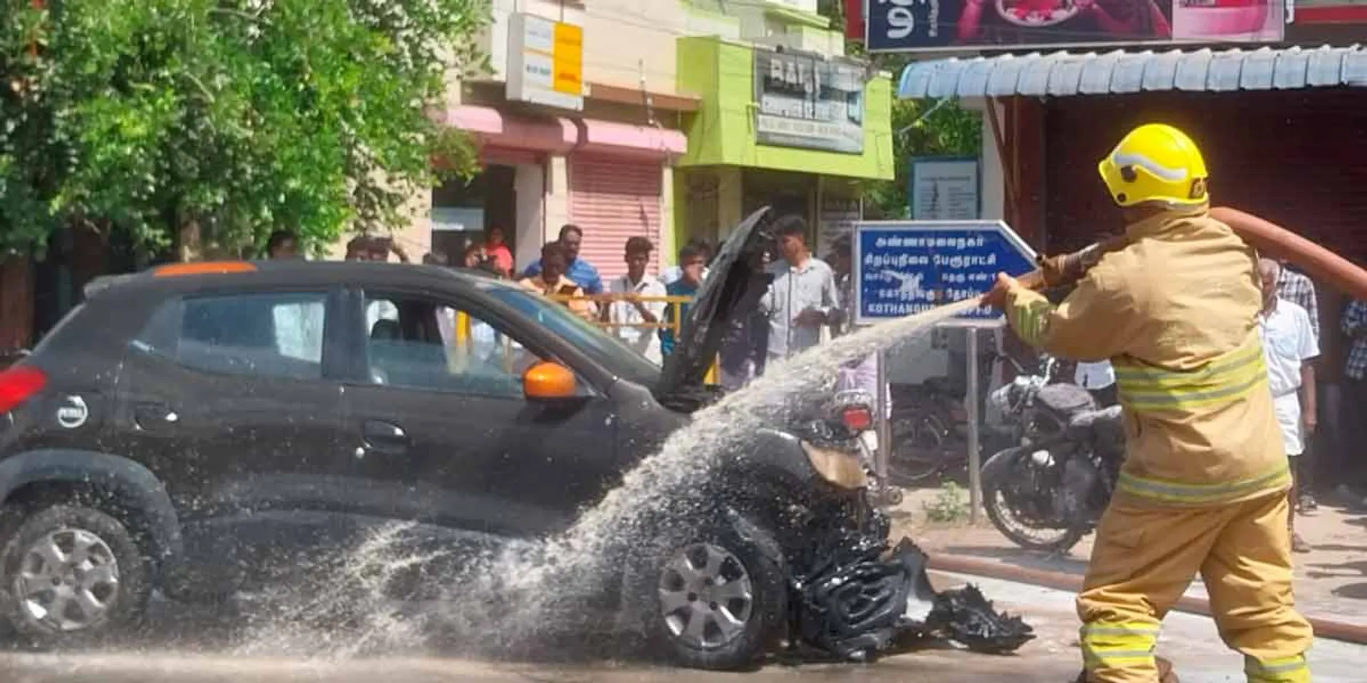 A car on the road caught fire