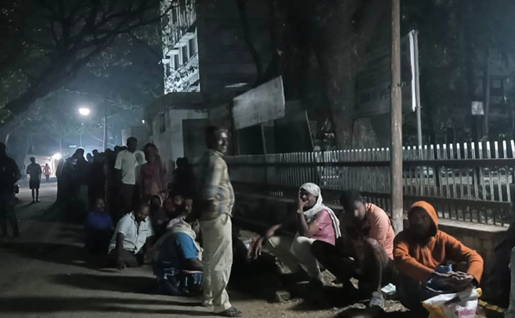People waiting at the door of ration shop at night to renew Aadhaar card!