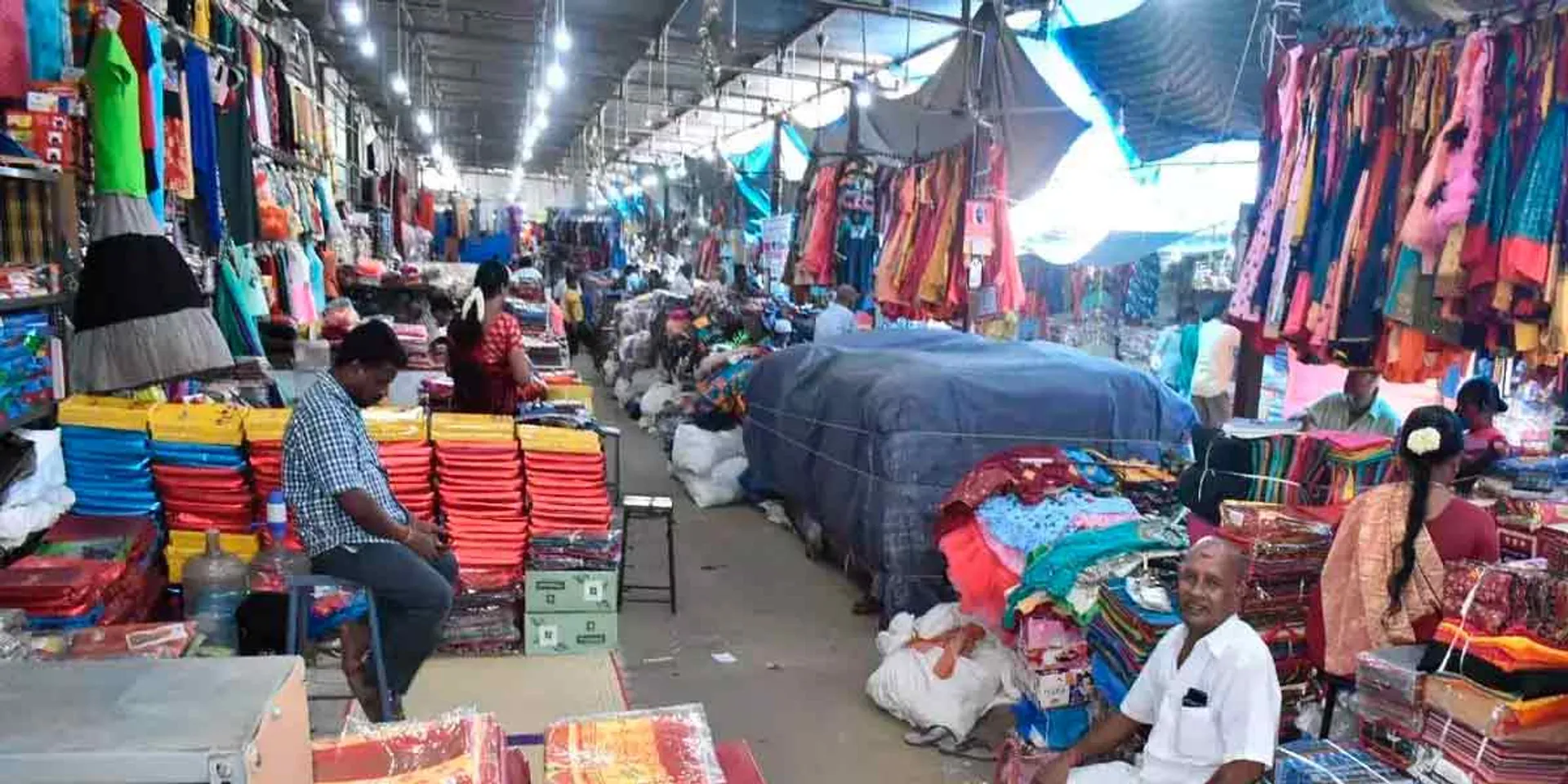 Business dulled by rain; A deserted cloth market
