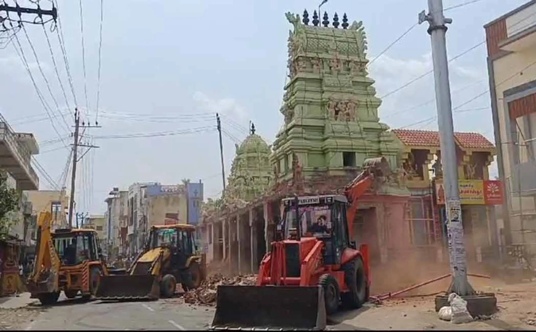 Officials demolish the temple as per the court order