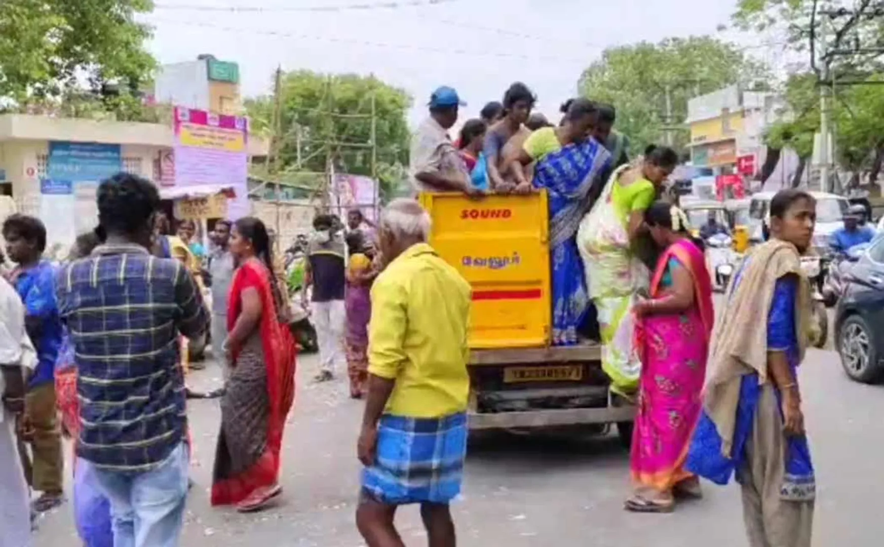 Corporation employees who brought people in a garbage truck to give biryani