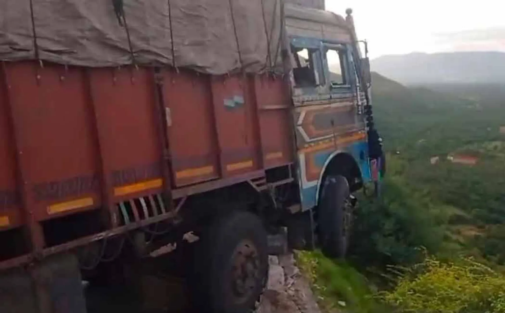 lorry hanging in the distance at the top of the 800-foot mountain