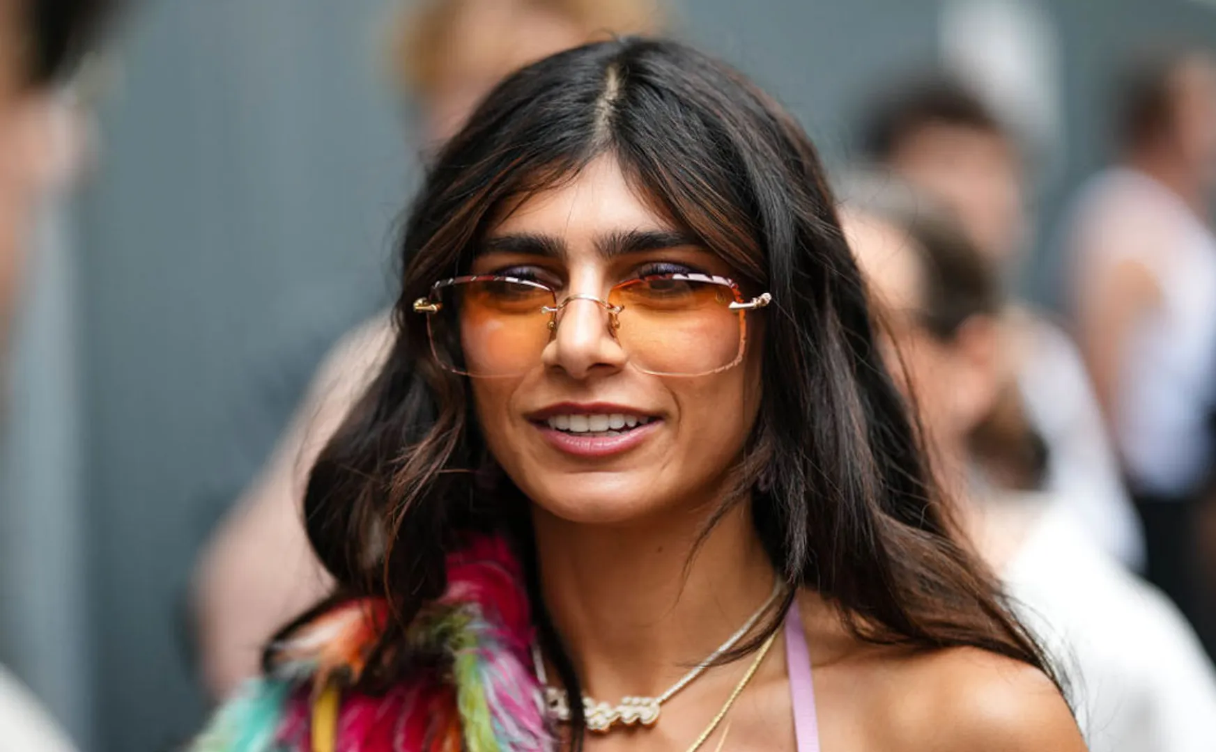 Young people carrying banners holding Mia Khalifa in festival