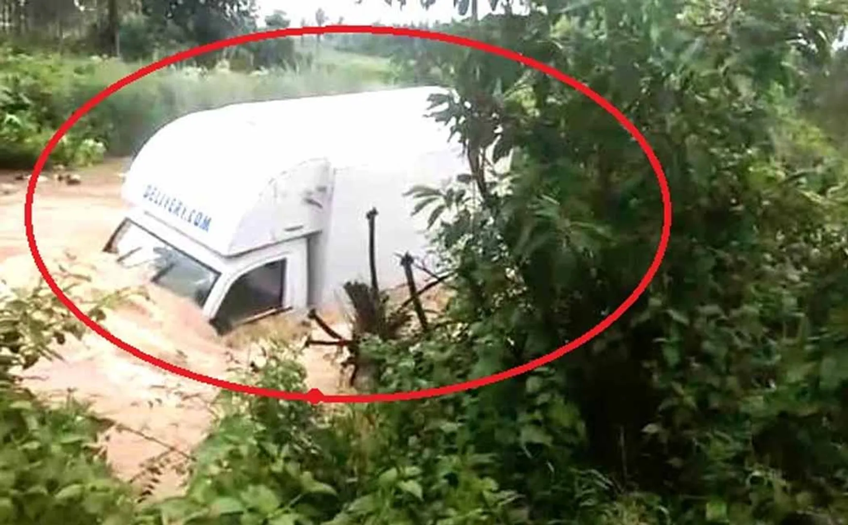 Van swept away in flood Smart people