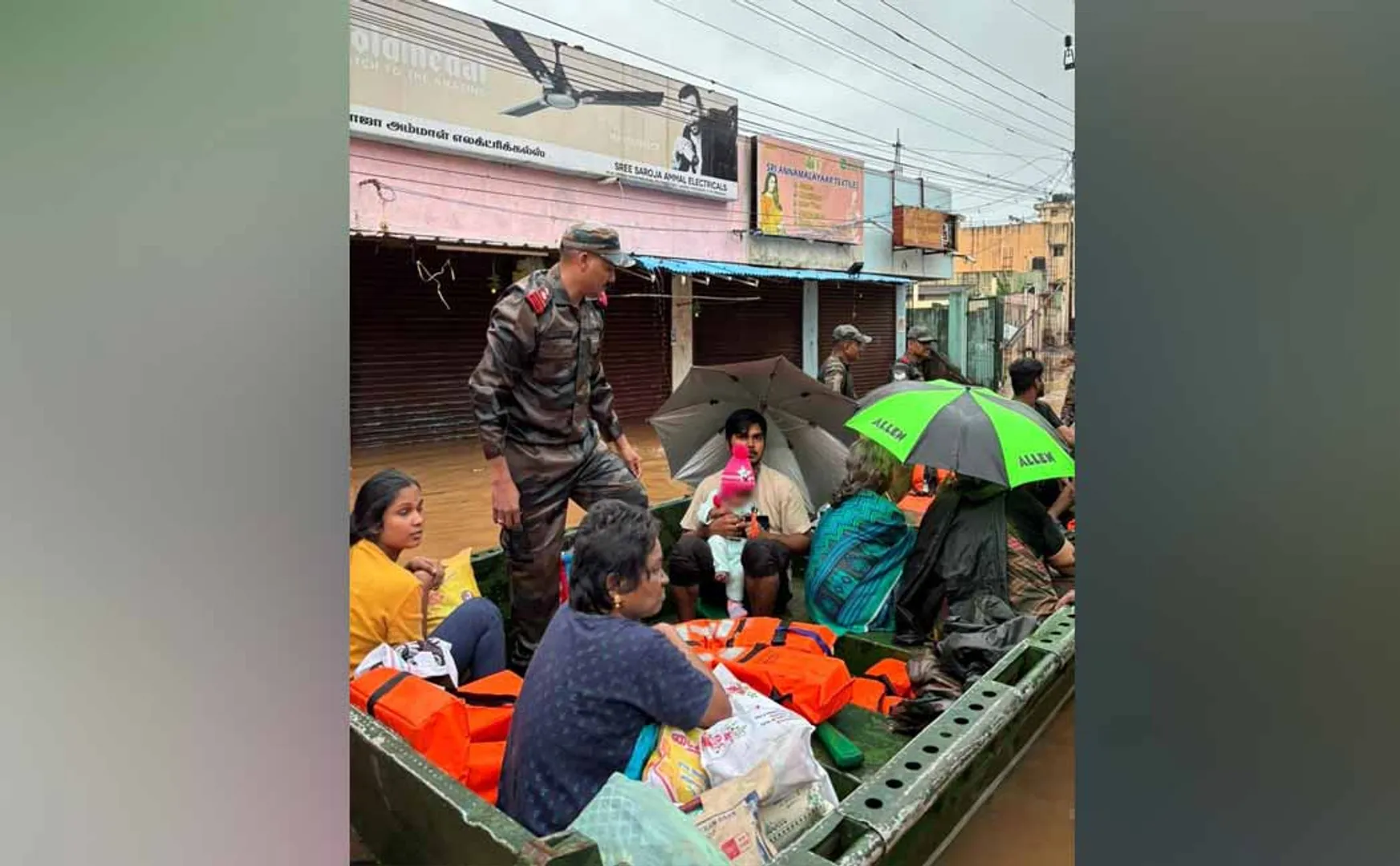 Rainwater surrounding the residences Soldiers embarked on a rescue mission