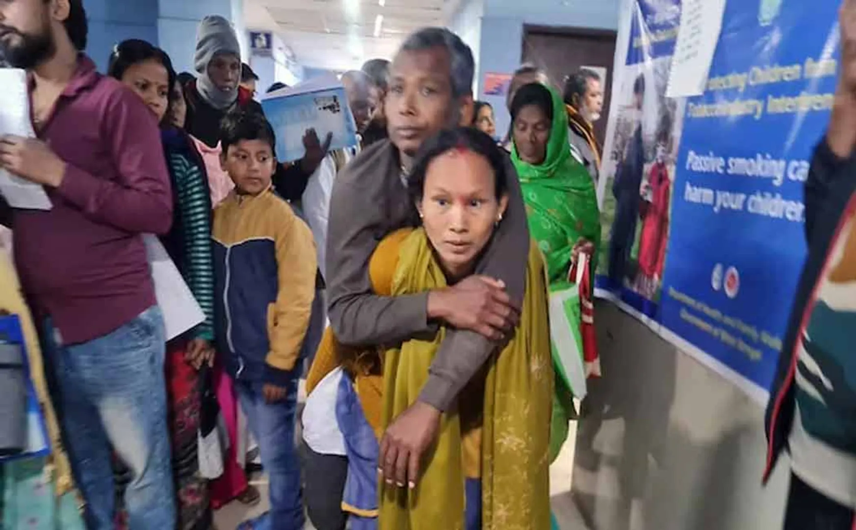 A woman carried her husband on her back because no wheelchair was provided in west bengal