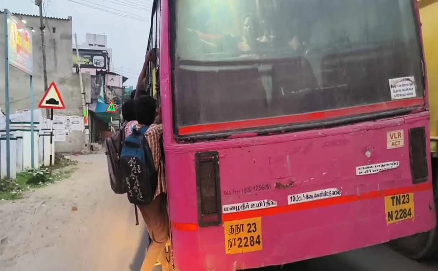 A miserable situation due to lack of additional buses for School students traveling hanging from stairs