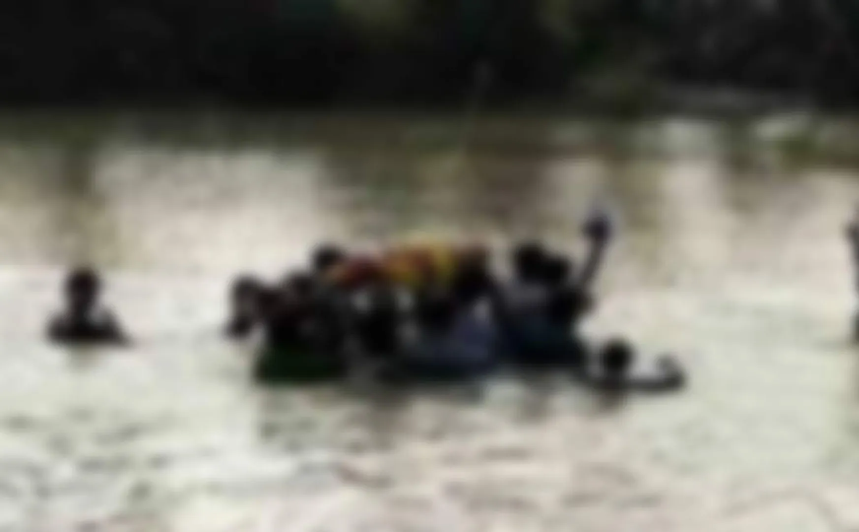 plight  carrying body through waist-deep water due lack access cemetery