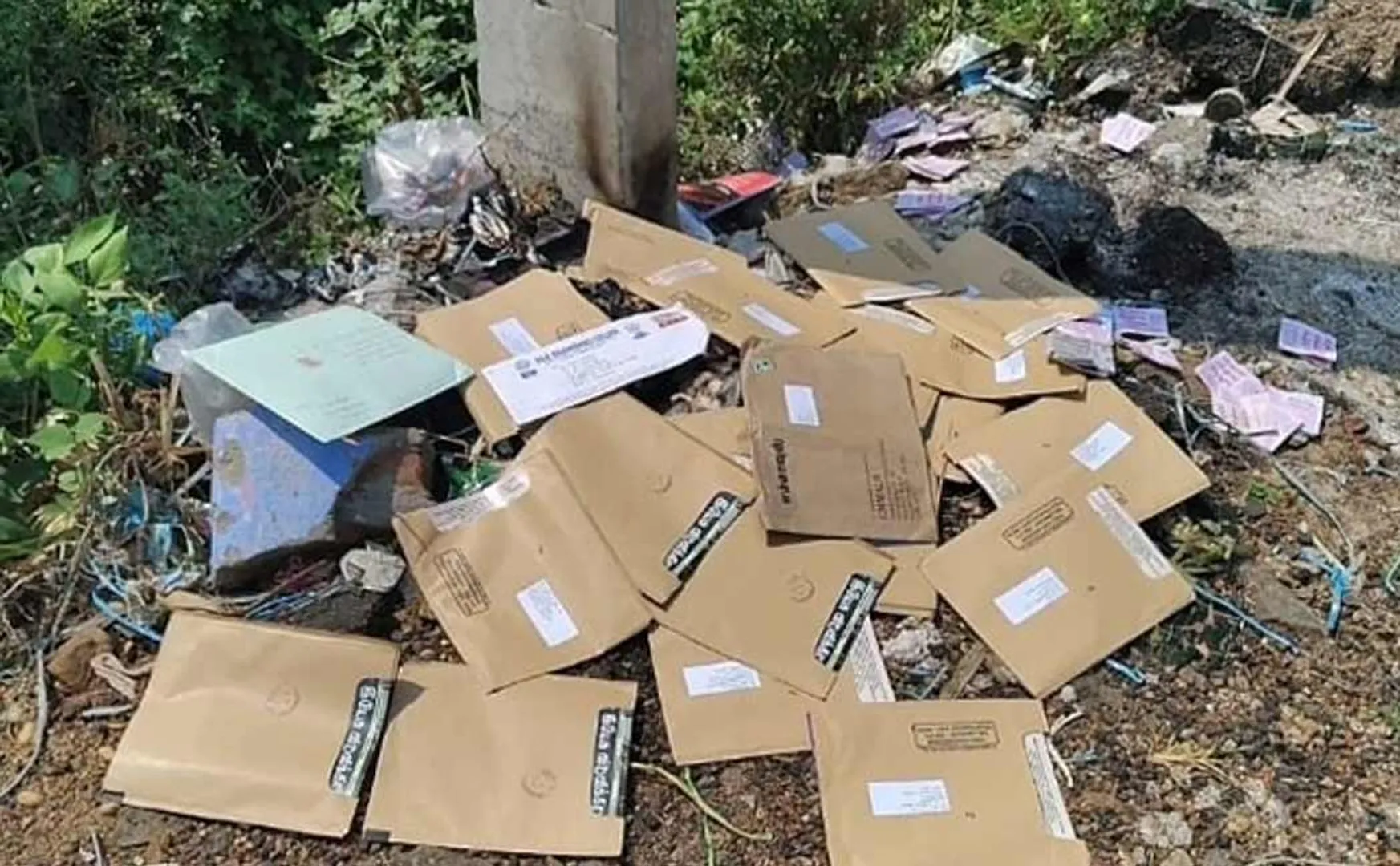 Hundreds of postcards thrown on the road in Kalugumalai