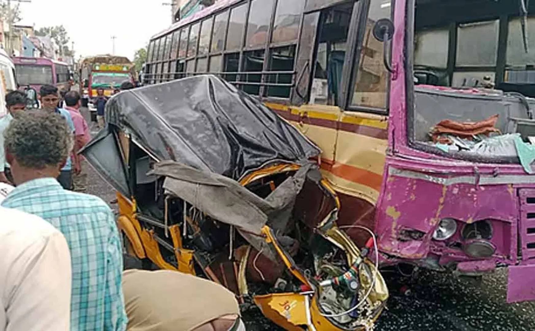 Government bus and auto collide head-on 
