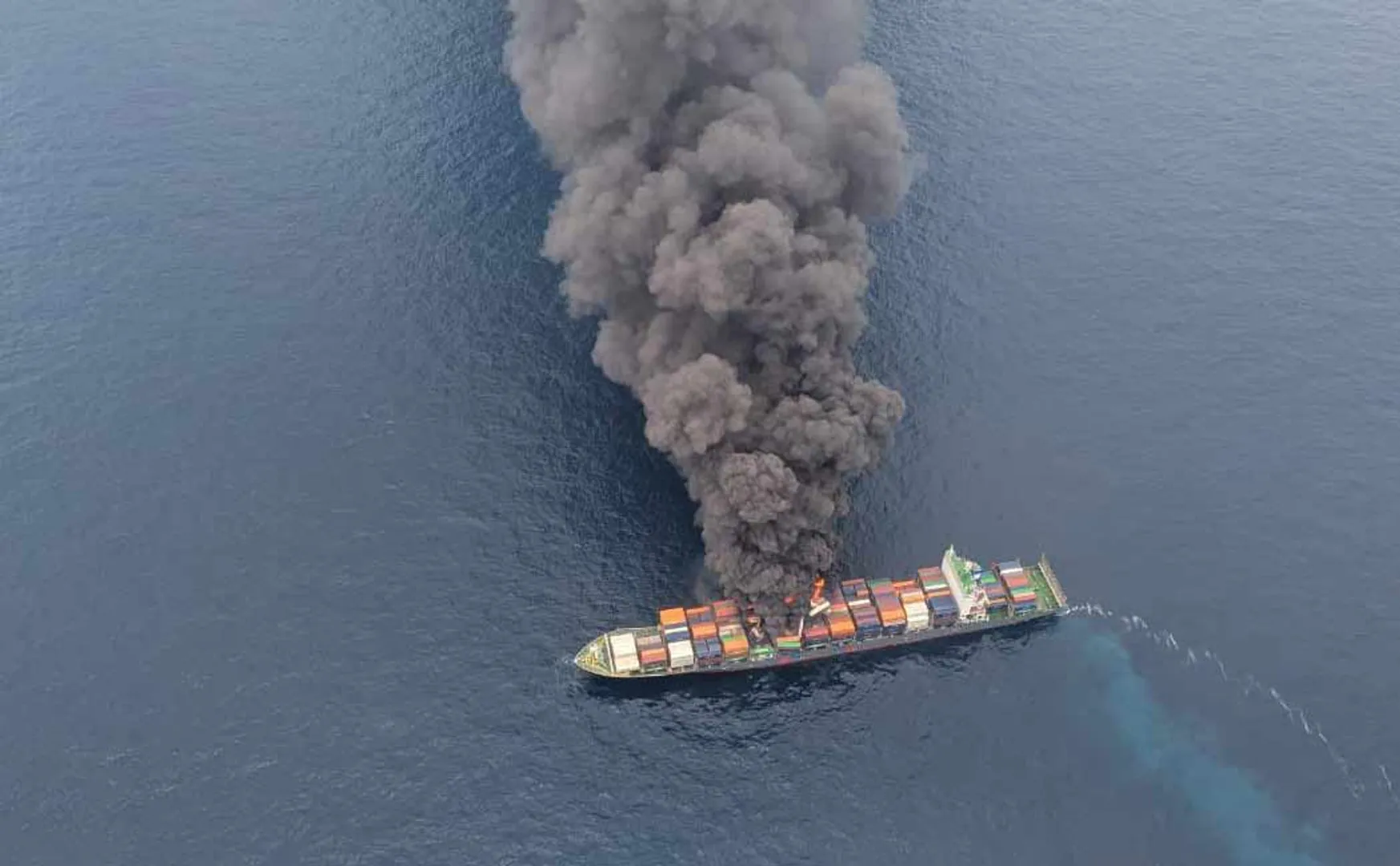 A ship on fire in the middle of the ocean kerala