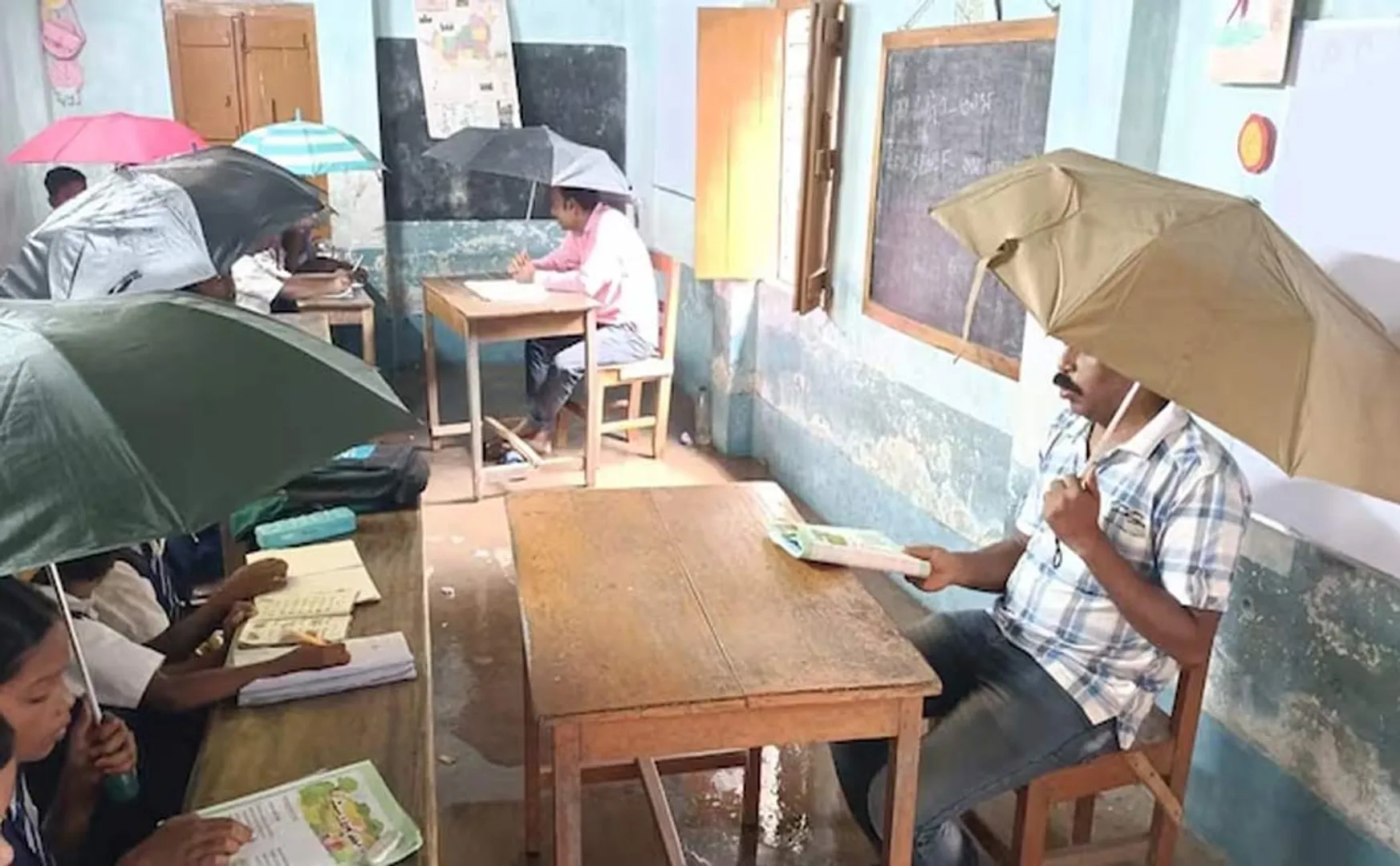 Students holding umbrellas class government school west bengal