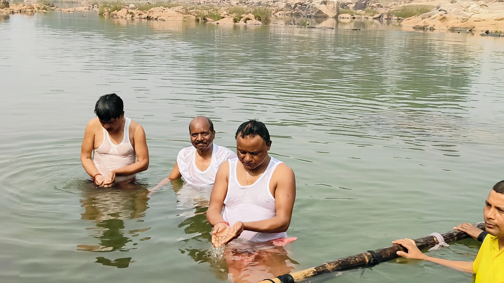 CM Majhi taking dip in Baitarani