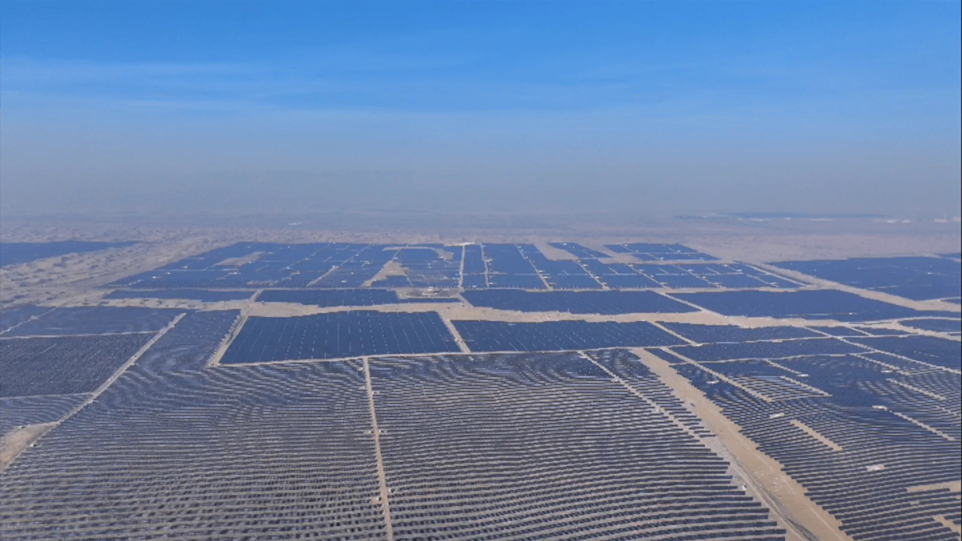 DAS Solar’s 2 GW Kubuqi deployment used dual-glass modules to reduce wind speeds and support ground vegetation.