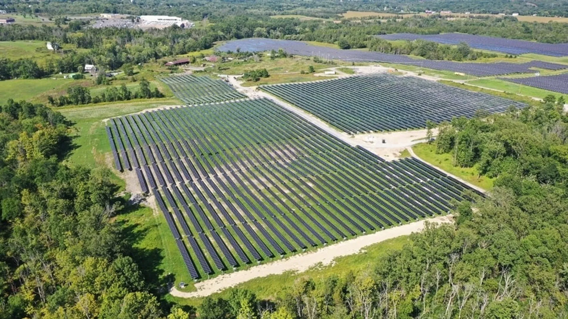 The ESFA-backed Clover Meadow Solar project used 13,338 panels to power 1,417 homes and cut 14.9 million lbs CO₂ annually.