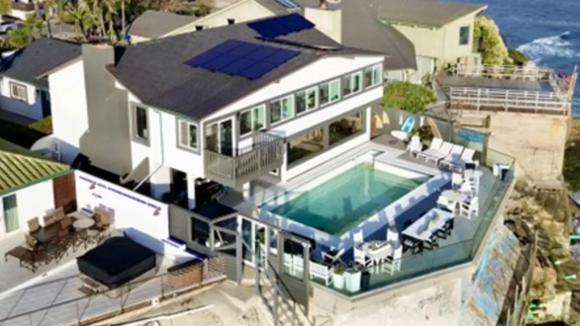 The installed system integrates Monolith PV panels with Enphase Energy inverters for module-level digital control.