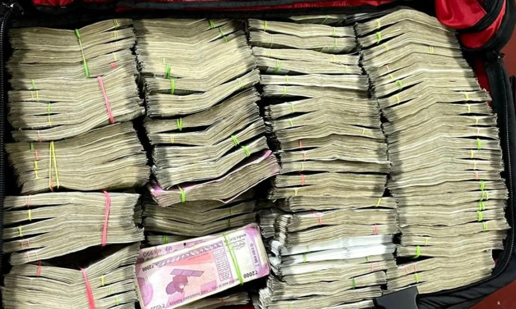 It was raining cash Engineer throws ₹1 crore out of window during raid