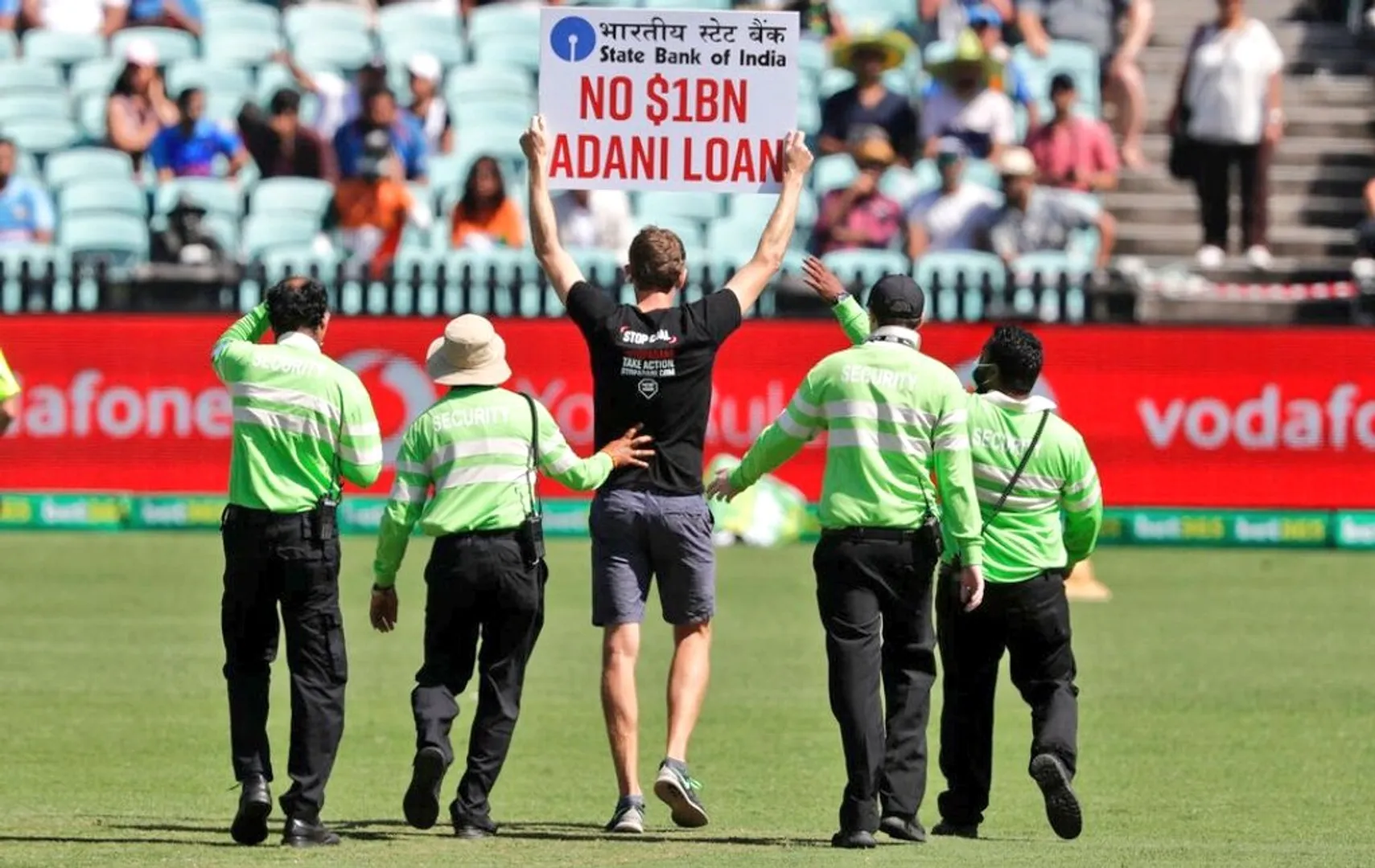 Two protesters barge into ground holding ‘No $1Bn Adani Loan’ signs during India vs Austalia ODI