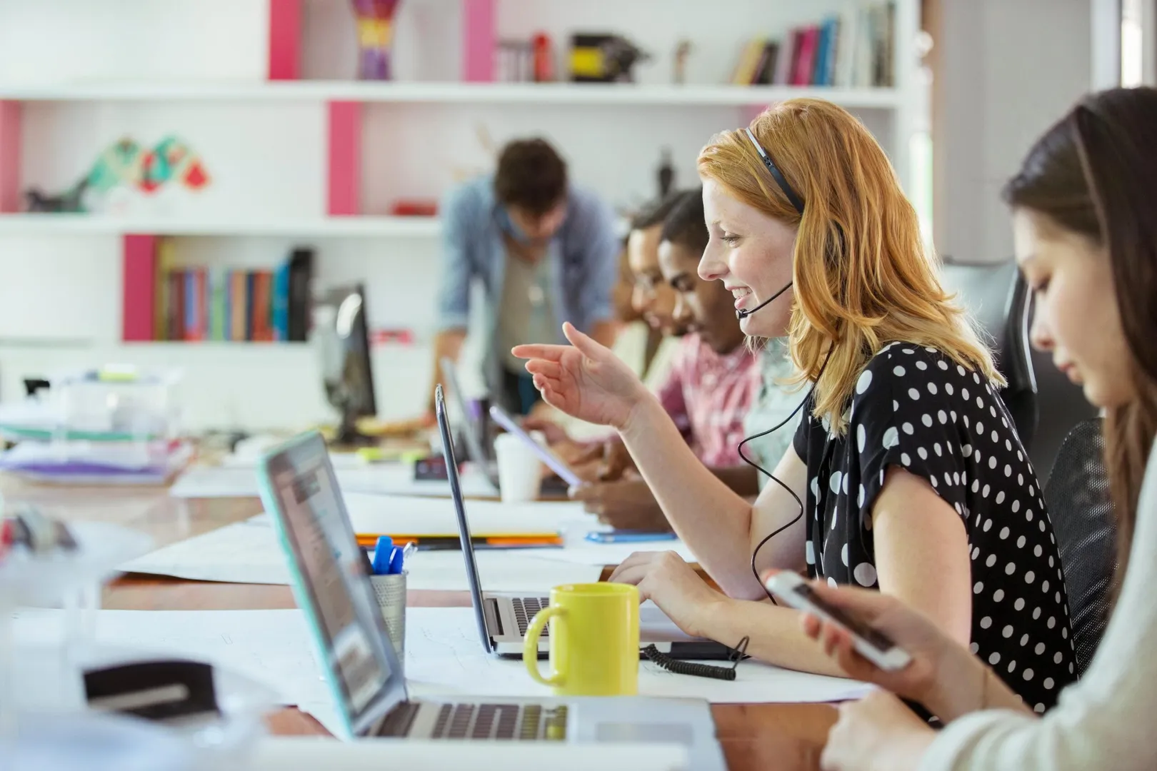 People working at conference table in office