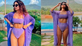 Khushi Kapoor rocks a lilac bikini with a sheer shrug and bold shades –