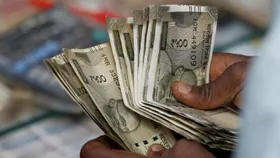Rupee rises 8 paise to 87.50 against US dollar in early trade