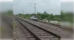 car on rail track post image