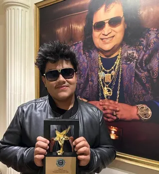 Rego B poses below portrait of legend grandpa Bappi Lahiri