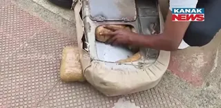 Large haul of cannabis seized from secret chamber of car; two arrested