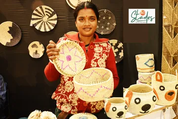 Dipali Mura with her handcrafted ecofriendly Sabai grass products