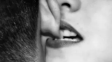 Women bites his husband ear