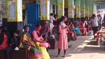 passengers at bus stop