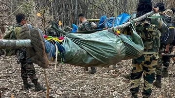 Armed Forces Carrying Bodies Of Dead Naxals 