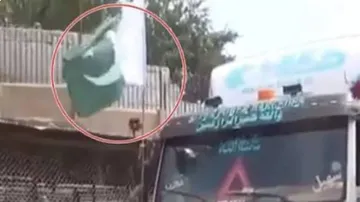 Taliban Fighter Tore Pakistan Flag