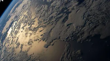 Earth brightness dimming