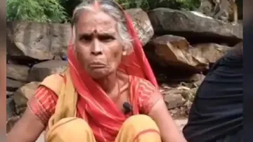 Old woman singing with harminium