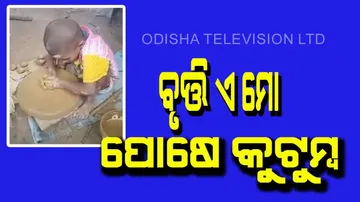 Child was making earthen lamps for diwali