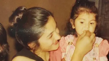 This girl in mother lap is a big bollywood actress