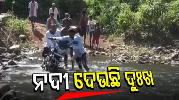 People Risk Their Lives To Cross River 