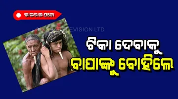 Man carries father on back to get covid vaccine