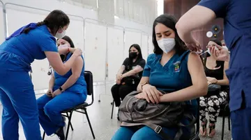 Center may allow covid vaccine booster shot for people travelling abroad