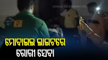 Doctors Treat Patients On Mobile Torch Light