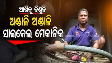 Man without sight repairs cycle