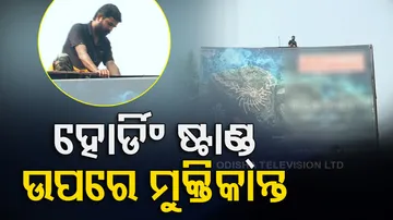 Muktikant Biswal Climbs Atop Of Advertisement Hoarding In Bhubaneswar
