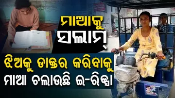 UP woman drives e-rickshaw