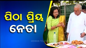 BeMC Mayor relishes ice-cream, pitha during Raja festival