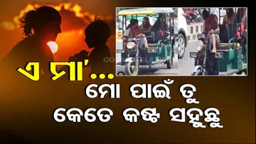 Mother Driving E Rickshaw With Holding Baby 