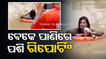 Journalist Reporting In Neck Deep Water Using Of NDRF Equipments