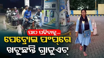 Young girl works at petrol pump 