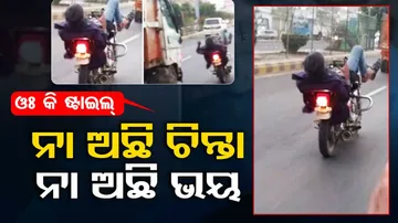 uses phone while riding bike 